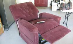 Burgundy Lift Chair, fully reclines & lifts to almost standing position, lighted remote control, storage pockets on sides. Excellent condition, very comfortable. Picture appears lighter that actual. $300.00