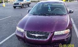 A 2000 Chrysler Cirrus colored maroon. Its a four door power window and doors. It has a clean carpeted interior, with 102,466 for milage. It even has a working FM AM radio. It is a energy efficent car because it gets you from place to place. However it
