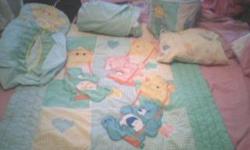 care bear crib set has blanket, crib sheet, bed skirt, bumper, diaper holder can call or text 787-0069 if verizon or e-mail