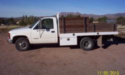 White one ton dually single cab with stake bed, great for work or play, 160,000 miles, regular maintenance every 3k to 5k miles. Great condition. Runs great. Rebuilt title. Alos have spare parts.