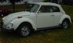 I am selling my 1978 triple white -( white interior, white body and white convertible top) Volkswagen beetle convertible.
It has always been stored inside and is in mint condition. This is a real people pleaser - everytime we take it out, a crowd
is