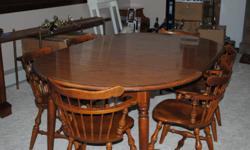 Classic Ethan Allen dining room table and six chairs in great condition!&nbsp; This set is considered a classic by Ethan Allen and is no longer made by the company.&nbsp; It is made out of solid hard rock maple.&nbsp; The table comes with two table top