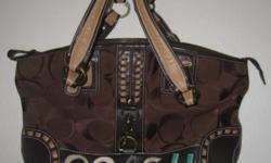 Large brownish COACH purse.