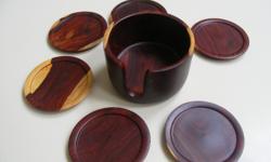 This coaster set is hand carved from beautiful rosewood (cocobolo). It consists of six coasters and a coaster holder. The coasters and holder are solid cocobolo wood.High quality cocobolo is becoming more rare and valuable every day. This wood is