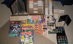 The lot consists of:
? A few thousand miscellaneous cards: Baseball, Football, Hockey, Basketball, Super Stars Musician cards.
? Five collector books.
? Set of collector coins.
? Four boxes of what appear to be complete ?Tops? brand sets from 1986, 1987,