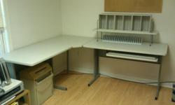 Corner Computer Table with drawer:
Excellent condition
24" Wide x 5'-3" x 6'-3"
Includes:
Grey fabric office chair
3 Fellows CD Racks
3 Letter racks
&nbsp;