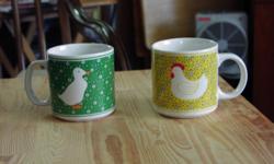 Nice coffee mug set of four mugs with country animals on each cup. In great condition!