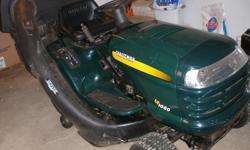 17.5 hp 42 " deck with rear double hard bag acc., always stored in shed 6 years old, look & runs great, new battery