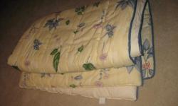 Full size comforter, one pair of lined drapes with tie backs, two valances, two shams and a bed skirt. Gently used. In excellent condition!