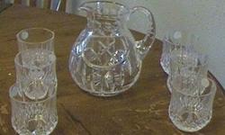 Here is a beautiful set of six crystal glasses (tumblers) and matching heavy crystal pitcher. I received these as a gift many years ago and promptly put them in storage. They've been there ever since, never used. I guess I just don't do much socializing