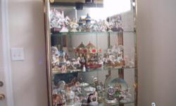 Large double glass door with brass handles. Beveled glass shelves, all mirror back, lighted with five shelves. Right now houses my Carousel Horse Collection. Curio is in EXCELLENT condition. Price is firm.