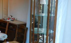 Tall wood mirrored curio cabinet.&nbsp; Excellent condition
