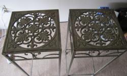 Very cute pair of plant stands/side tables in fantastic condition! Nice detailed scrollwork on the top of the stands. Measurements are 28 1/4 inches tall, 11 1/2 inches wide and 11 1/2 inches deep.