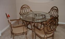 Glass top table and 4 chairs. Great condition.