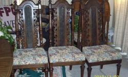 Mediterranian set w/ six high back chairs, Table is oval shaped and has a leaf and can seat eight. Is in good condition, all chairs have been newly upholstered. Table measures 62" long x 42" Wide; Leaf is 18" wide. Total length of table is 80" Long