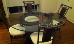 Very nice glass top dining room table with 4 chairs. Very nice and in great condition. You will need to arrange movers and pick up. Will be available for pick up between March 17-31 only. $300, Cash only.
