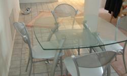 We have a glass 4 place table set for sale from a smoke-free, pet-free, very clean home in Oviedo ? near UCF.
Table
Height: 29?
Depth: 41 1/2?
Width: 41 1/2?
Chairs
Height: 33 1/2?
Seat Height: 18?
Depth: 17 1/2?
Width: 30 1/2?
Materials: Glass and chrome
