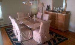 Cream color marble dining room table with 6 high back chairs.
Granit top china cabinet with oak bottom