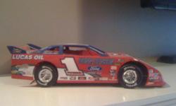 I have a dirt late model collection for sale. I have most popular drivers. 25 plus cars!!! Year models vary. I also have two race car cabinets to show them.... they are mirrored with a race track in background and they are also lighted. I'm including pics