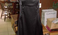 Donna Morgan little black dress, size 14, brand new with tags. Comes with sheer black shell, size 14, also new with tags. Dress has spaghetti straps. Shell has satiny fabric that matches the dress around the waist and sleeves.