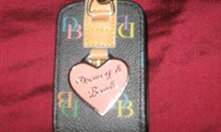 Brand New Dooney & Bourke Cell Phone Holder...NEVER USED!! Have original box. Must sell..lost job and need to take care of my older horse.