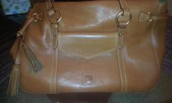 Florentine Vachetta Satchel Hand bag New I paid over $400.00 with taxes It's all about the bag. Classic and timeless, this satchel has impeccable style and impressive space. A must-have for any wardrobe, this bag won't disappoint. From Dooney & Bourke.