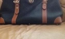 Never used Dooney & Bourke Purse for sale. It was purchased for $225.00 from QVC and comes with a small change purse. Purse must be picked up.