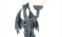 Description
What an awe-inspiring way to illuminate your castle! Reminiscent of centuries-old European carvings, this roaring dragon holds aloft a glowing glass globe. Pair them on either side of a doorway for a grand entry!
Specification
Polyresin with