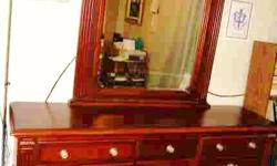 Cherry dresser, with a huge mirror - 9 drawers - plus center with 2 shelves,
Paid $450 will take $200...