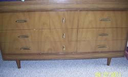 Light pecan wood 6 drawer dresser. In pretty good condition. 724-433-7813