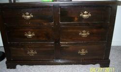 Dark wood 6 drawer dresser. Is worn and has scratches, but very sturdy. If interested call 724-433-7813.