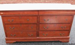 Eight (8) drawer dresser with mirror. Dresser has a few scratches and missing drawer handles but otherwise in good condition....no broken or damaged drawer guides. Dresser dimensions (66"W X 18"D).