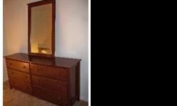 Solid wood dresser in good condition.