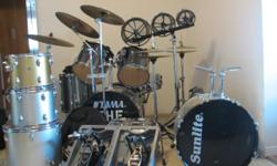 Tama Rock Star (nearly new) drum set
Full complement of Zildjian cymbals (5)
Two hi-hat stands /cymbals (Zildjian)
Iron Cobra double bass drum pedal.
1 tama single pedal
Set of roto-toms
3 Chrome snare drums Very good sound quality
1 SHURE head worn Mic
