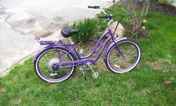purple pedego electric bike,sadle bag,lights, helmet.20 mph