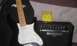 behringer electric guitar and amplifier,comes with case and new strings