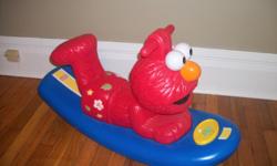 This is a rocker with handles designed to look like elmo is surfing. It also is electronic so elmo laughs when you rock. I have a bunch of other kid stuff