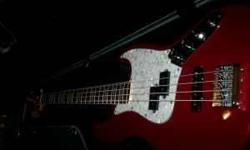 Elita Certain Bass, custom made Jazz bass with PJ Duncan pickup, SOUND IS GREAT!, Jazz neck with block inlays, Candy Red, White pearl pickguard, Heavy Duty Bridge, Hipshot Drop D tuner, Hard case, This bass cost over $1200 new a yr ago, down sizing gear.