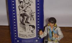 McCormick A Portrait of Elvis. American Porcelain. Straqight Bourbon Whiskey 86 Proof.
Music Box Grenadine, IN it's orginal Box. Have seen it advertised for $89.00 to $150.00.
So if you collect Elvis or know someone that does would make a wonderful gift