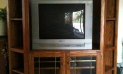 BROWN AND IS VERY WELL MADE! HOLDS A 42" REGULAR TV