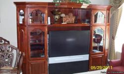 Beautiful Cherrywood Entertainment center in great condition. Only $800. Side doors open to hold lots & lots of DVD's and more. Call Mike at 602-920-7412.