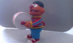 Ernie, stands approx. 6" high.&nbsp; He plays a base drum.