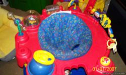 EvenFlo MegaSaucer, large version of an exer-saucer for babies/early toddlers. its not Brand new, I bought it when my first son was born in 2006 but its been in storage til Feb 2011 when my youngest began using it.. and he just turned 1 yr old so i'm