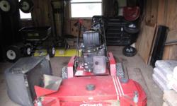 commericial grade,14 horsepower mortor, includes bagger, one owner, older but very good condition, new blades and cable. only cut my yard with it