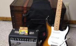 Fender strat with ,amp,20ft cord , stand , tuner (new)&nbsp;,and soft carring bag This is great guitar and in good shape for sale .Comes with everything you need to star playing or learning to play , The only thing is the guitar has a smaill chip on the
