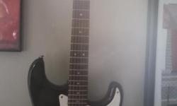 Black Fender Squire Bullet Strat with white pick guard. In great shape. Made in USA. CASE NOT INCLUDED.