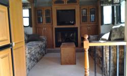 2004 FLEETWOOD WILDERNESS ADVANTAGE AX6 365 FLTS. FRONT LR, ELEC. FIREPLACE,2 AC, NADA AVE. RETAIL 16730, SELL FOR 15500.