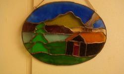 This small stained glass cabin was made by hand in a corner of a little room,in a little house by m. gibson who lives at the foot of the green mountains of vermont,