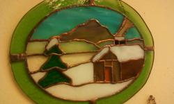 This large stained glass cabin was made by hand in a corner of a little room,in a little house by m. gibson who lives at the foot of the green mountains of vermont