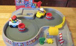 *~*~This is a Really cute little Fisher Price Race way Sets.... The road ways spin around and it comes with the two little cars and people. I have additional fisher price sets... They are one for 15.00 or two for 25.00 *~* (excepts deluxe barn set ) *~*